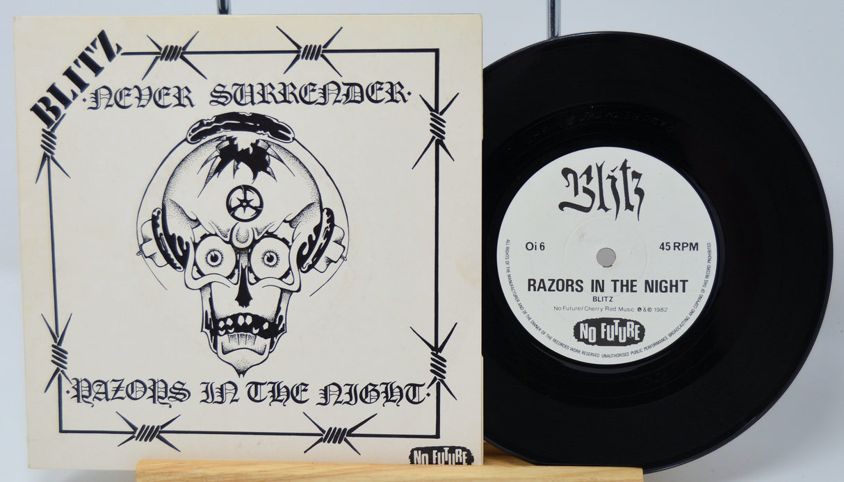 Vinyl record with cover titled 'Never Surrender' by Blitz on a light gray background.
