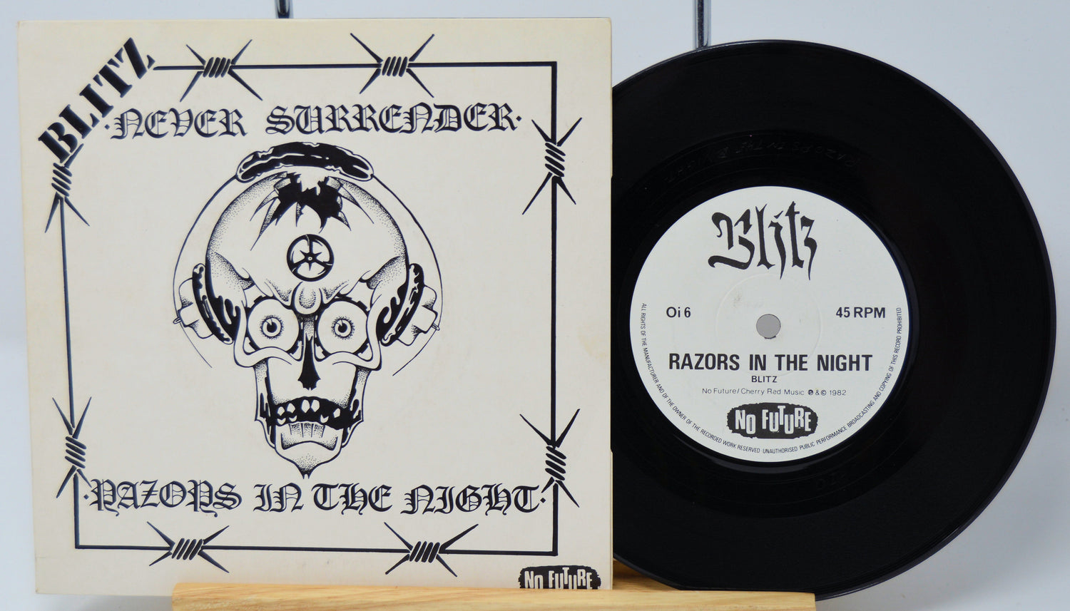 Vinyl record with cover titled 'Never Surrender' by Blitz on a light gray background.