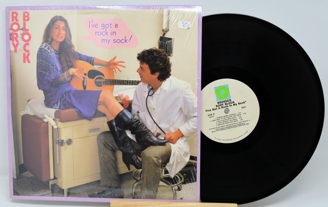 Vinyl record with cover featuring a couple and text 'I've got a rock in my sock!'.