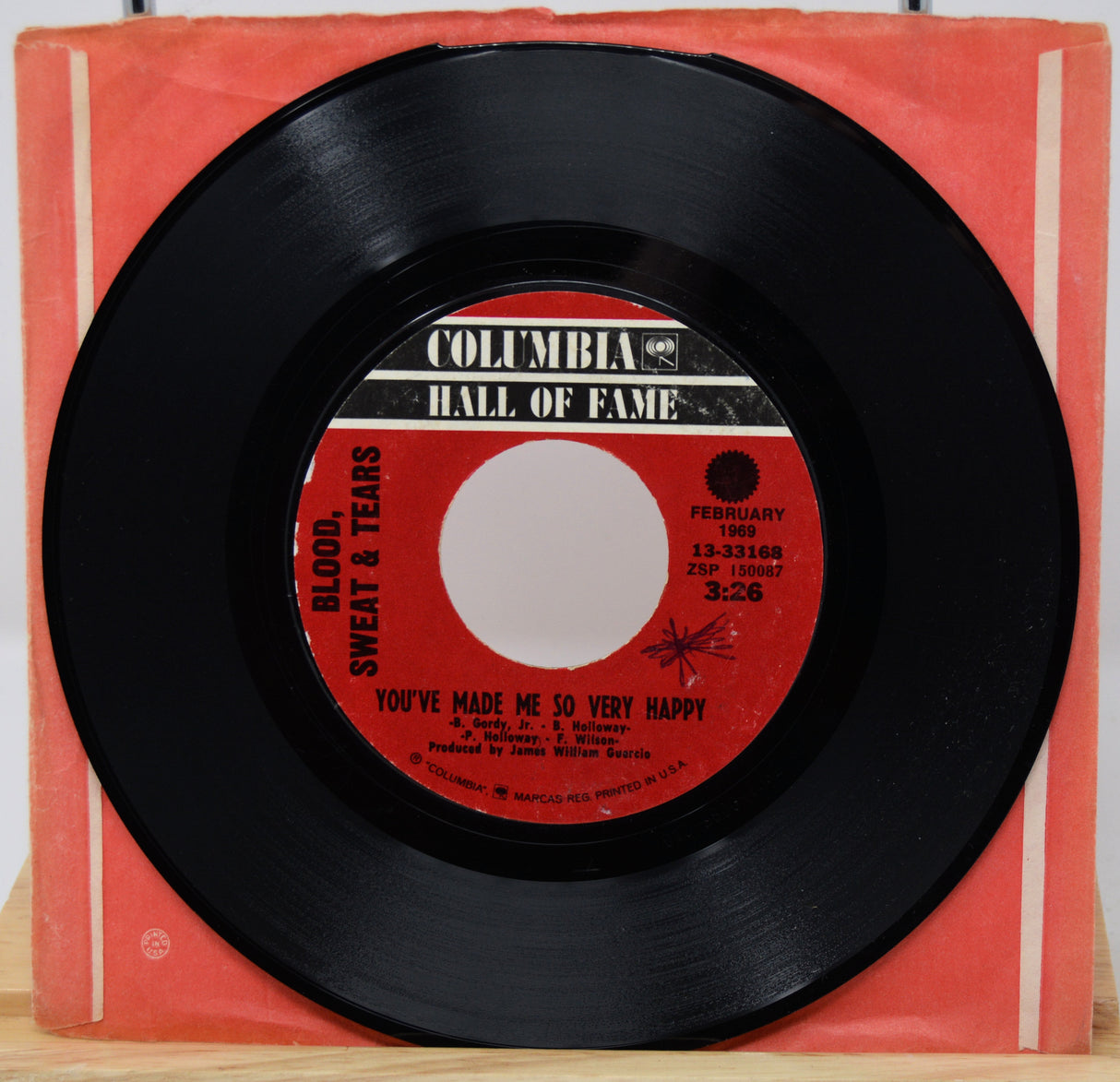 Vinyl record with red label on a red Columbia Hall of Fame sleeve