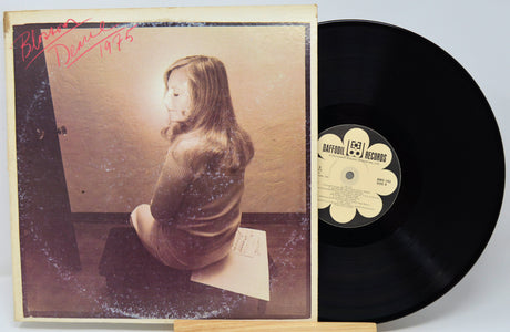 Vinyl record with cover featuring a person and 'Daffodil Records' label.