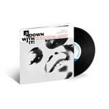 Vinyl record and cover with a stylized face design on a white background