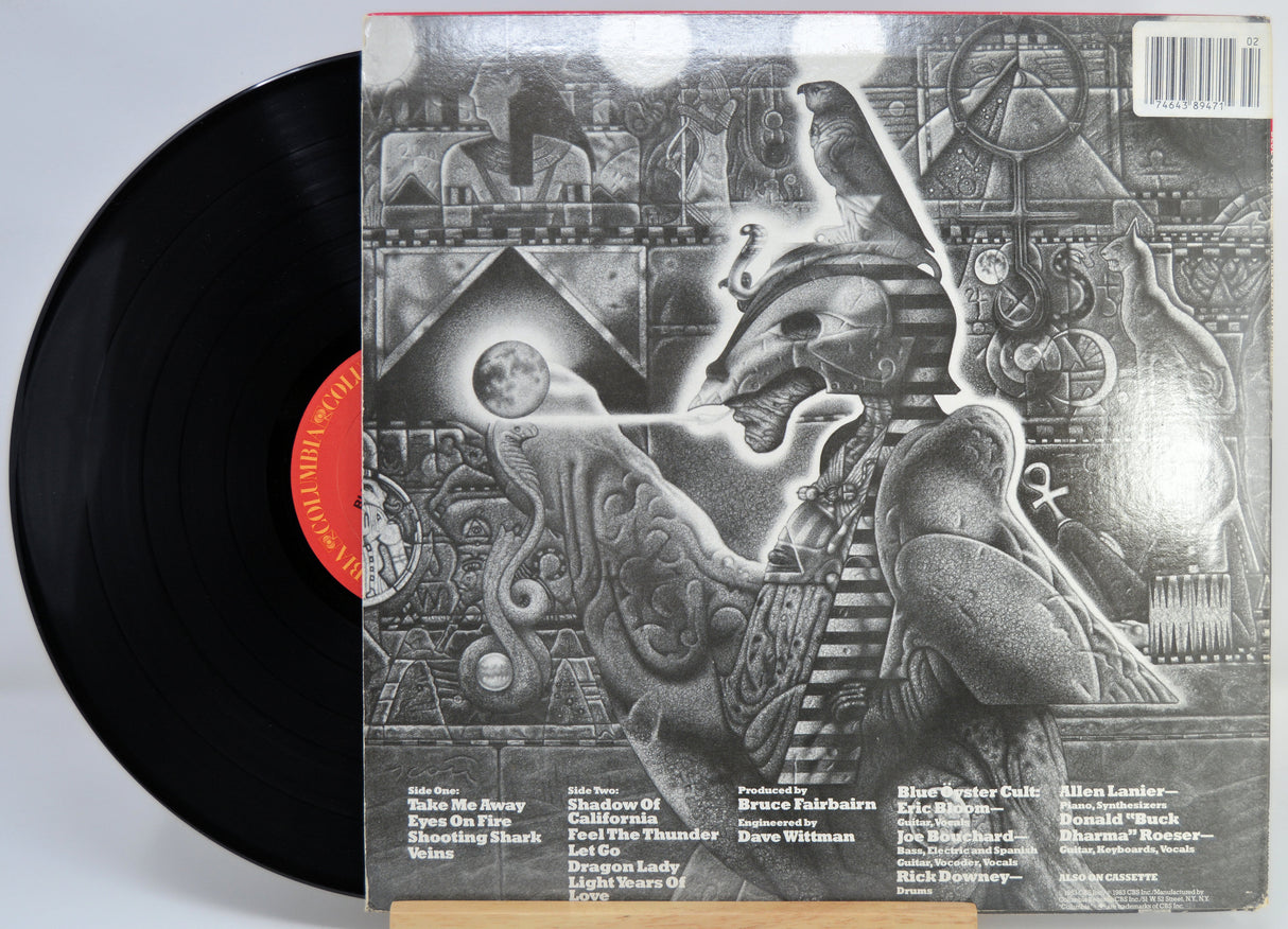 Blue Oyster Cult - Revolution By Night Vinyl record with a detailed back cover featuring artistic design and text.
