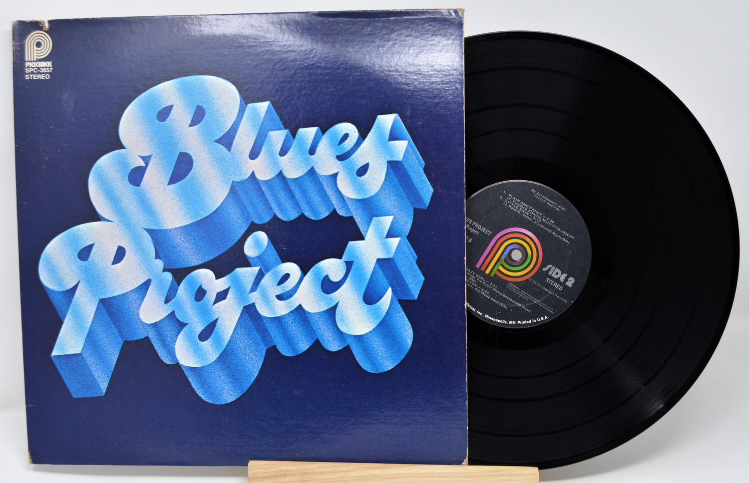 Vinyl record with 'Blues Project' cover on a white background