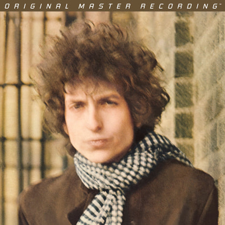 Person with a checkered scarf against a textured wall, with 'Original Master Recording' text at the top.