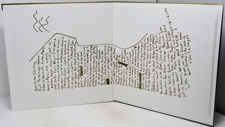 An open book or printed booklet on a white surface, showing a detailed topographic-style map drawn in brown ink with handwritten text throughout the pages.