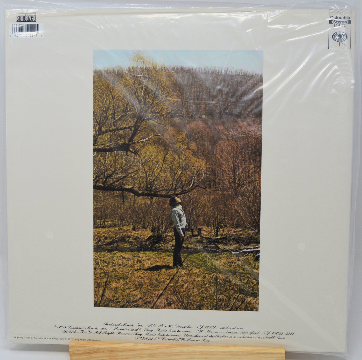 A vinyl record sleeve for 'Southern Farm' by Southern Farm Inc., featuring a printed photograph of a man standing in a field under trees, sealed in clear plastic shrink-wrap with a cardboard insert visible at the bottom.