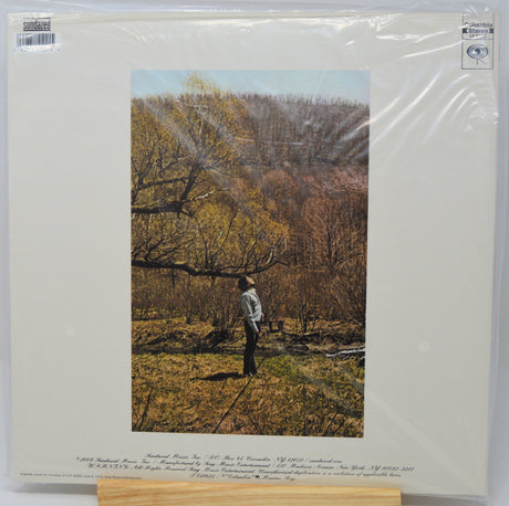A vinyl record sleeve for 'Southern Farm' by Southern Farm Inc., featuring a printed photograph of a man standing in a field under trees, sealed in clear plastic shrink-wrap with a cardboard insert visible at the bottom.