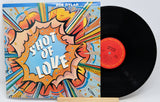 Vinyl record with a colorful cover featuring 'Shot of Love' by Bob Dylan