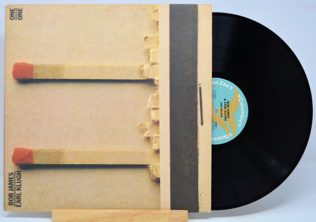 'Bob James And Earl Klugh One On One' Vinyl record with a matchbox design featuring matches and a record label.