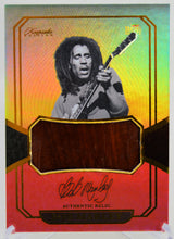 Bob Marley trading card containing a relic piece of acoustic guitar.  Keepsake Edition 2025