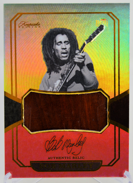 Bob Marley trading card containing a relic piece of acoustic guitar.  Keepsake Edition 2025