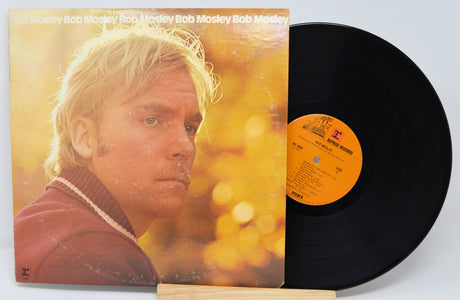 Front cover and vinyl record of Bob Mosley album featuring close-up portrait