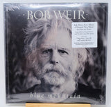 Bob Weir's 'Blue Mountain' vinyl record album, sealed in its original plastic shrink wrap. The cover features a black and white portrait of Bob Weir with his name in large white letters at the top and the album title at the bottom.