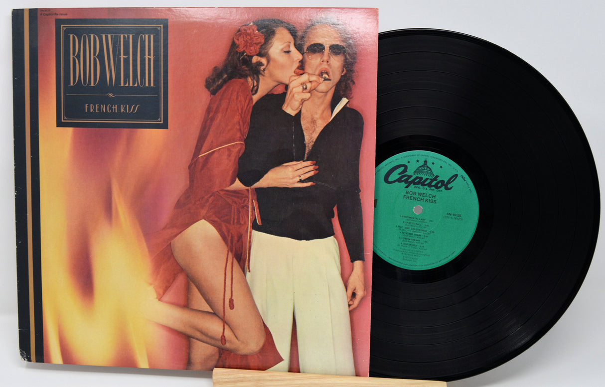 Vinyl record with a colorful cover featuring two people and a visible Capitol label.