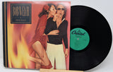 Vinyl record with a colorful cover featuring two people and a visible Capitol label.
