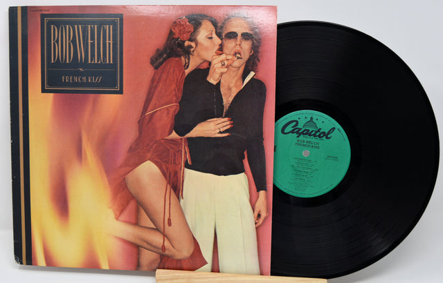 Vinyl record with a colorful cover featuring two people and a visible Capitol label.