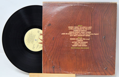 Back cover and vinyl record of Bobby Bare's 'This Is Bare Country' LP with tracklist