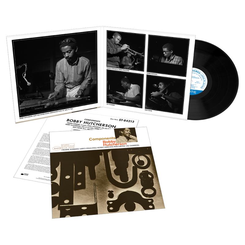 Vinyl record set with cover and liner notes featuring images of a musician.