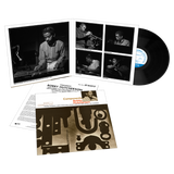 Vinyl record set with cover and liner notes featuring images of a musician.