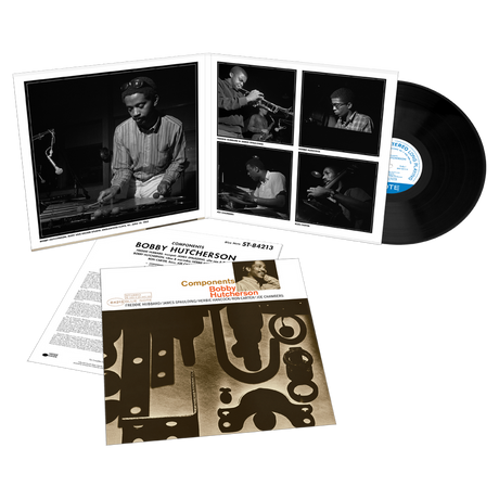 Vinyl record set with cover and liner notes featuring images of a musician.