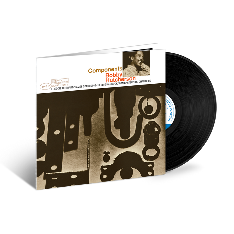 Vinyl record with a cover featuring a stylized design and a portrait of a person.