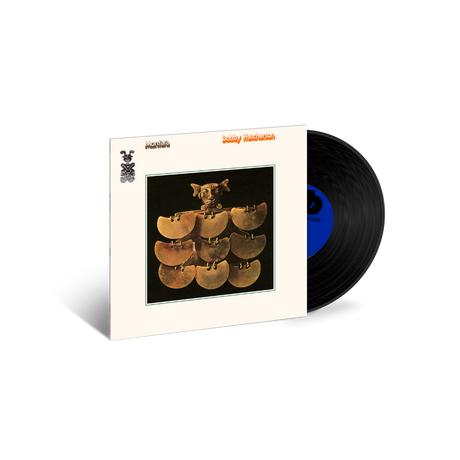 Vinyl record with cover featuring a stack of records and a bear, on a white background