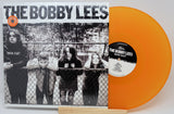 Vinyl record with orange disc and black and white cover featuring 'The Bobby Lees' band.