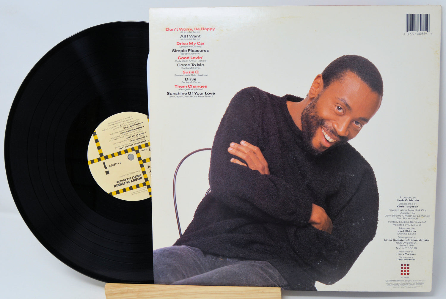 Vinyl record with a smiling man on the cover