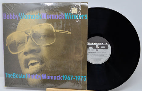Vinyl record with cover featuring a person wearing sunglasses, labeled 'The Best of Bobby Womack 1967-1975'.