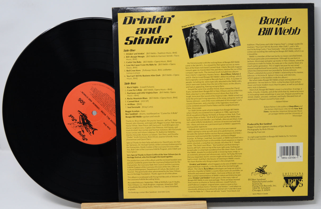 Vinyl record with a yellow label featuring text and images of people.