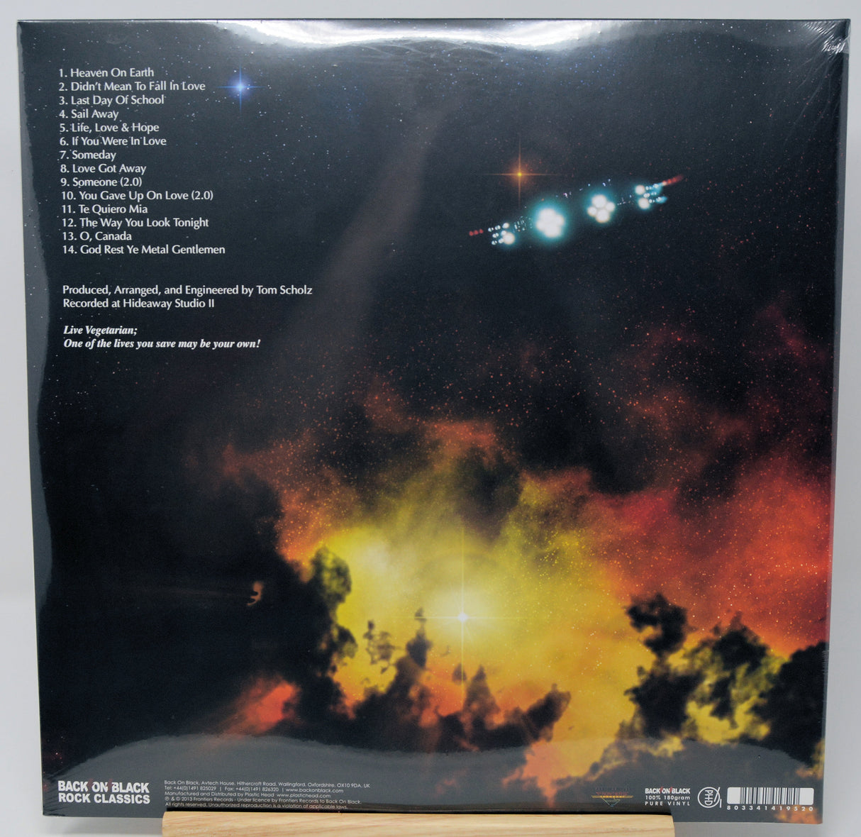 Back cover of a vinyl record sleeve for Black Book Classics, featuring a dramatic space scene with stars, planets, and a glowing nebula in black, orange, yellow, and red tones. Tracklist text is visible on the left side.