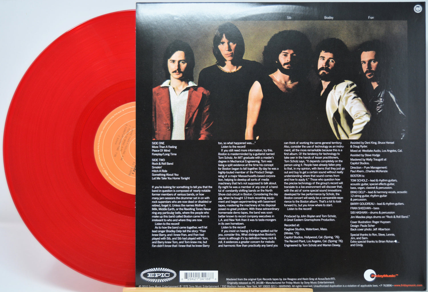 Red vinyl record with a orangelabel featuring the band 'Boston' portrait and text.