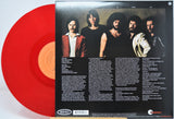 Red vinyl record with a orangelabel featuring the band 'Boston' portrait and text.