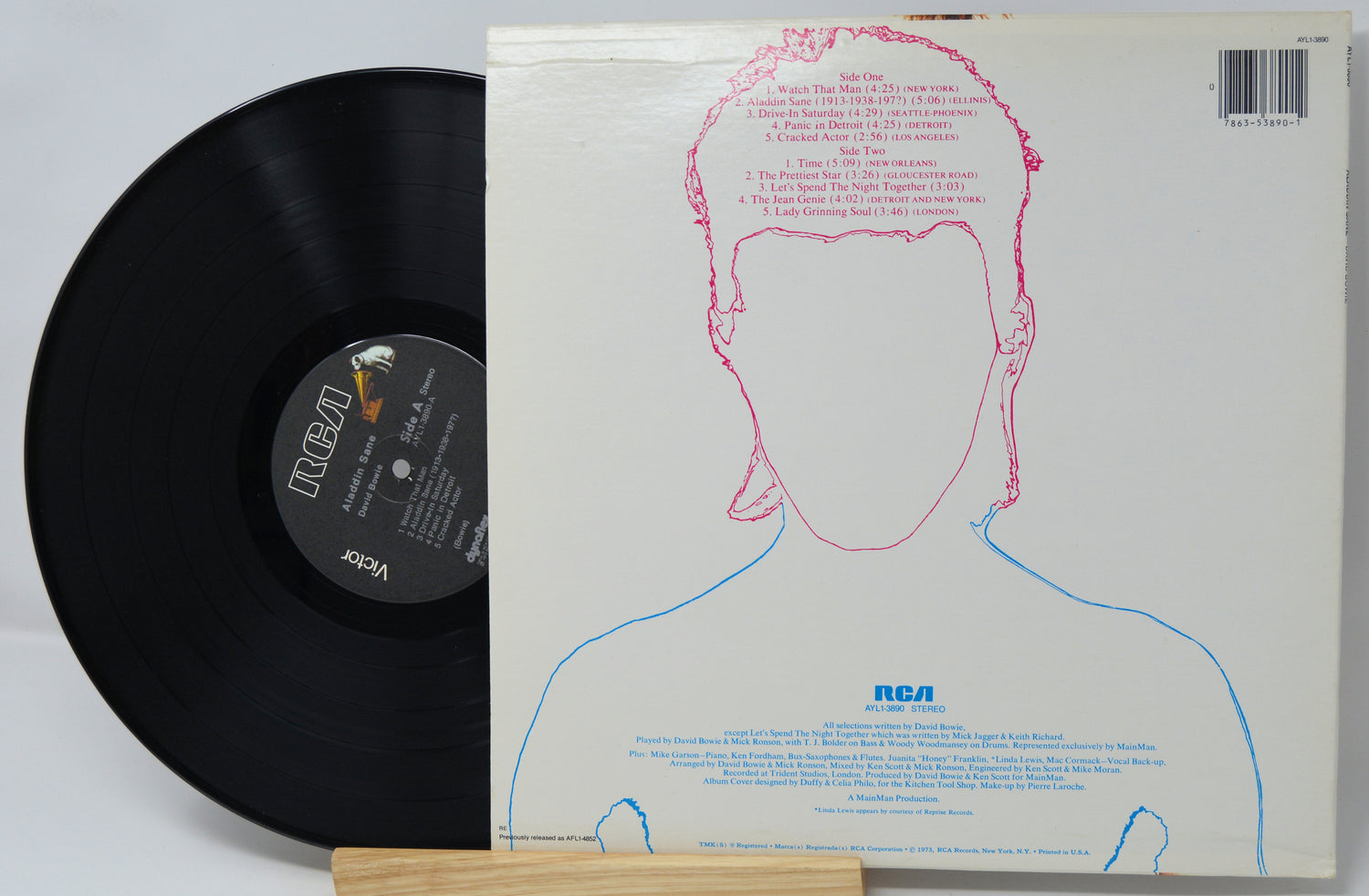 Vinyl record with a white cover featuring a face outline and RCA logo.