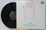 Vinyl record with a white cover featuring a face outline and RCA logo.