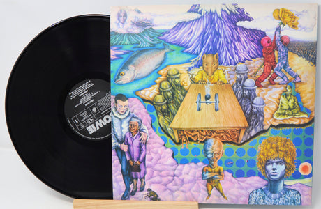 Vinyl record with a colorful album cover featuring abstract art and people around a table.