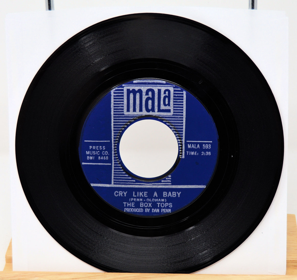 45 RPM record with blue label on a white background