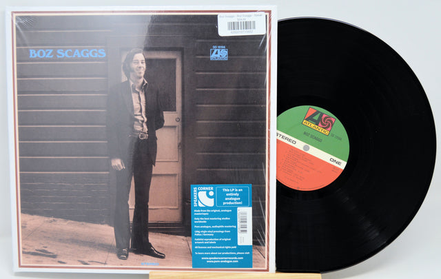 Boz Scaggs 'This LP Is an American Progression' vinyl record shown with the album cover and the black record partially pulled out, on a light gray background.