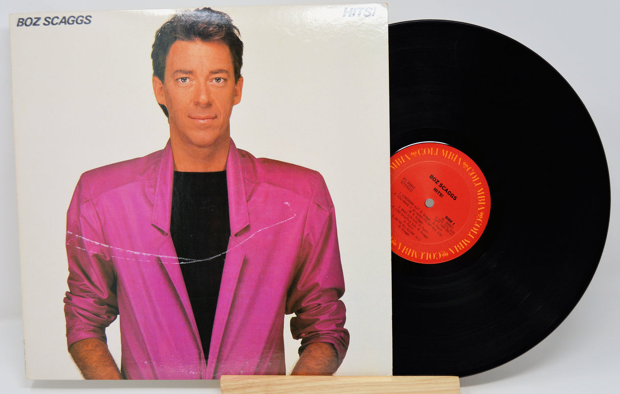 Vinyl record with a cover featuring a person in a pink jacket on a white background
