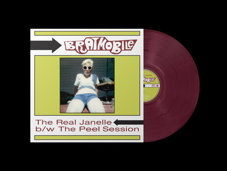 Bratmobile The Real Janelle vinyl record with cover artwork featuring a woman in sunglasses