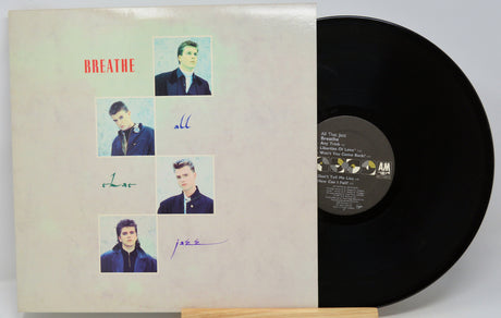 A signed vintage vinyl record of the band Breathe's 'All The Way' on AM Records, showing the cream-colored sleeve with signatures and the black vinyl disc partially pulled out.