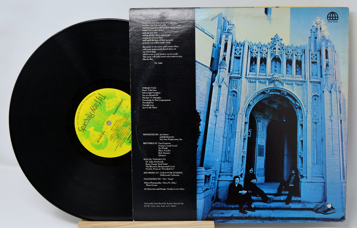 Vinyl record by Brethren with a black cover featuring a yellow label and a blue album cover with architectural design.