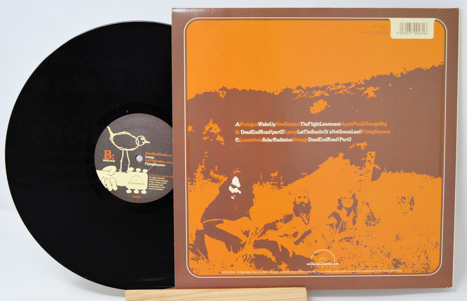 Back cover and vinyl record of Brimstone Solar Radiation Band LP with vintage orange graphics