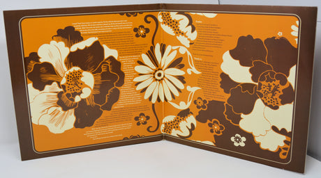 Retro vinyl gatefold with bold orange and brown floral psychedelic design and lyrics