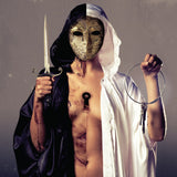 Person wearing a mask and holding a dagger and large loop keychain against a gray background