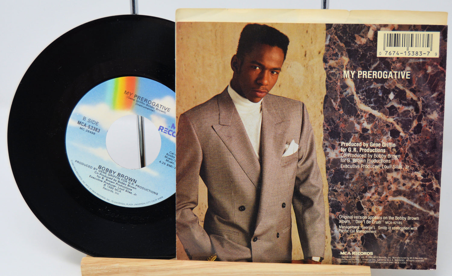 Vinyl record and cover with a man in a suit on a white background