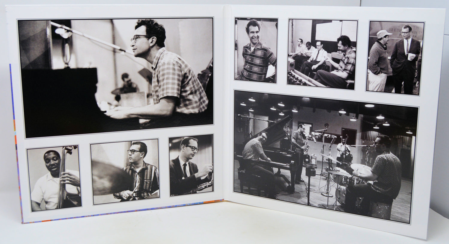A square white collage print featuring multiple black-and-white photographs of jazz musicians, including Louis Armstrong, Duke Ellington, and others, displayed on a white surface.