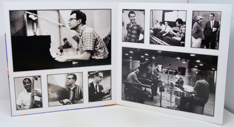 A square white collage print featuring multiple black-and-white photographs of jazz musicians, including Louis Armstrong, Duke Ellington, and others, displayed on a white surface.