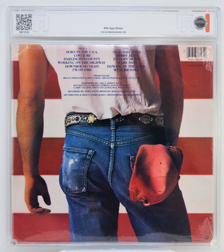 Album cover with a person wearing blue jeans and a red cowboy hat, set against an American flag background.